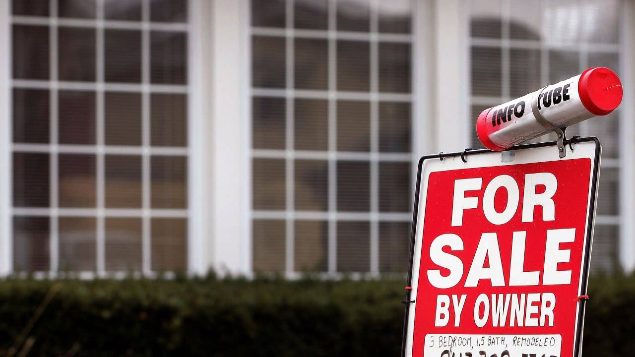 The "For Sale By Owner" sign with available information is seen in front of a home