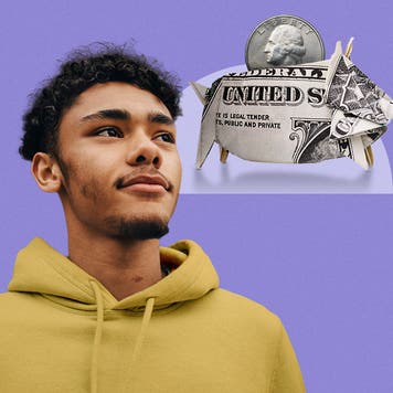 Person imagining a piggy bank made out of cash.