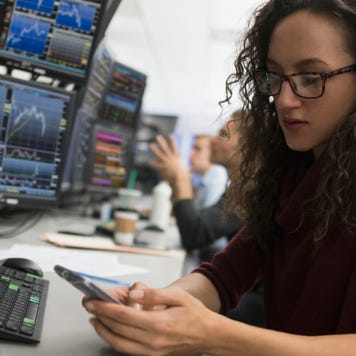 Professional broker checking graphs and date