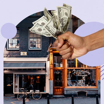 design image of a business front with a hand full of bills in the foreground