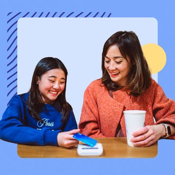 design element including two women and one is paying with a card the other holding a cup in her hand