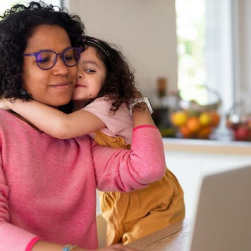 Mother with daughter looking at laptop