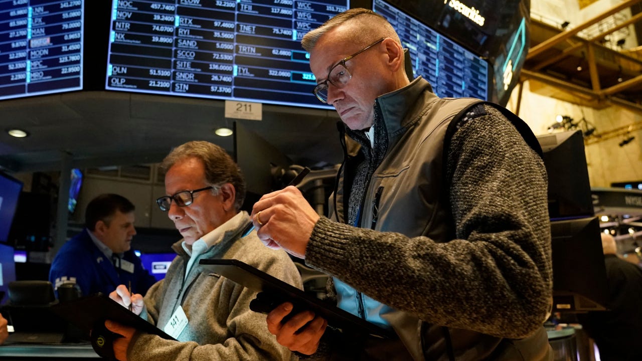 Traders on the floor of the New York Stock Exchange