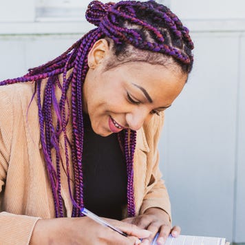 Woman works on business paperwork.