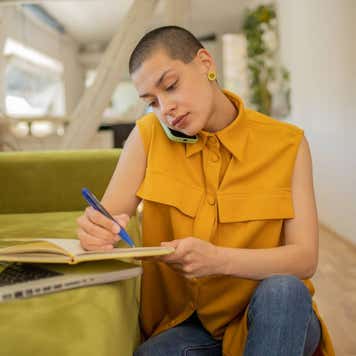 Happy young woman is enjoying working from home