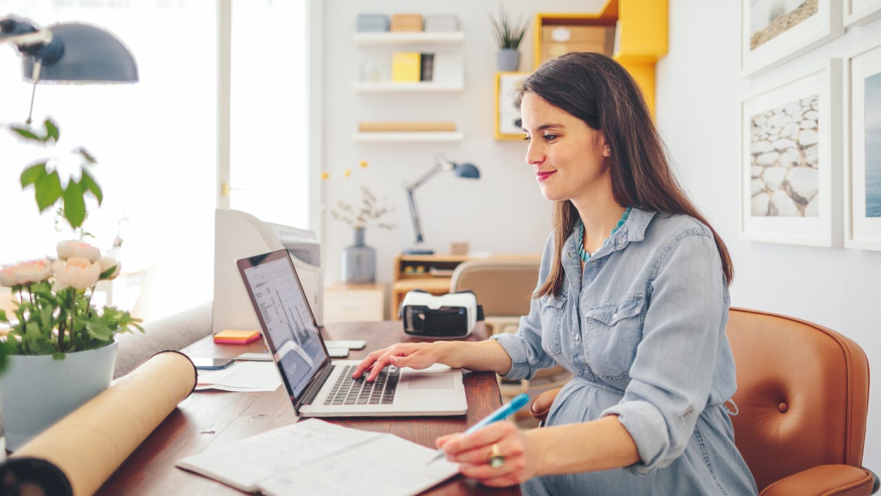 Pregnant woman working in a home office