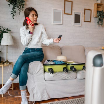 An Asian female tourist in hotel having problems paying with credit card