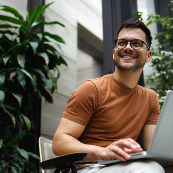 Happy man on laptop