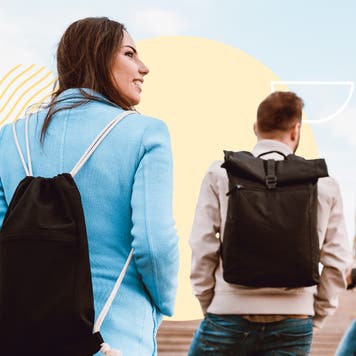 Young people walking and having talking on a college campus