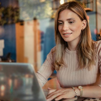 Happy woman using a computer