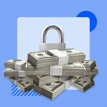 A large pile of cash next to a padlock