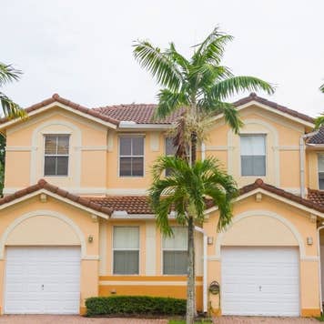 Modern middle-class colorful painted building details at Hammocks Doral neighborhood in Miami, Florida, United States of America, USA, sunlight illuminating at midday with a blue deep sunny summer sky.