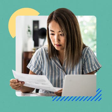 Person reviewing their taxes and/or financial documentation