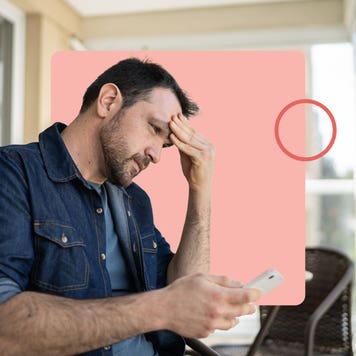 Worried man looking at cellphone