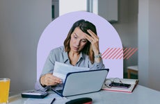 Women reviewing document feeling stressed.