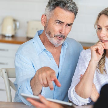 couple meeting investments and financial advisor at home