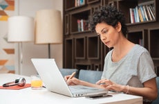 Woman comparing loans on her laptop