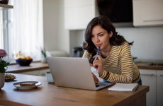 Young woman looking and comparing lenders online