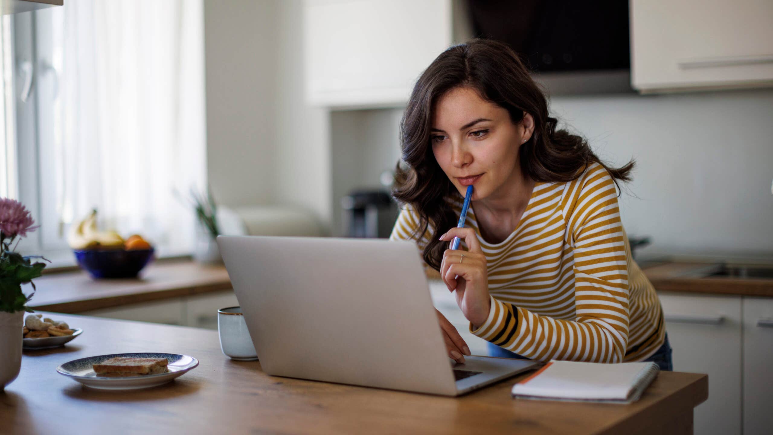Young woman looking and comparing lenders online