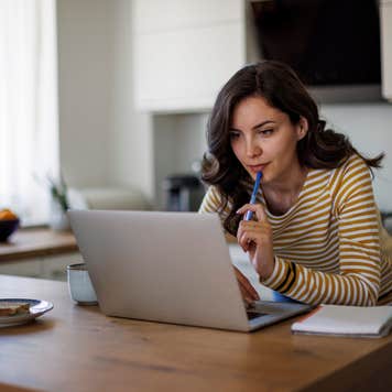 Young woman looking and comparing lenders online
