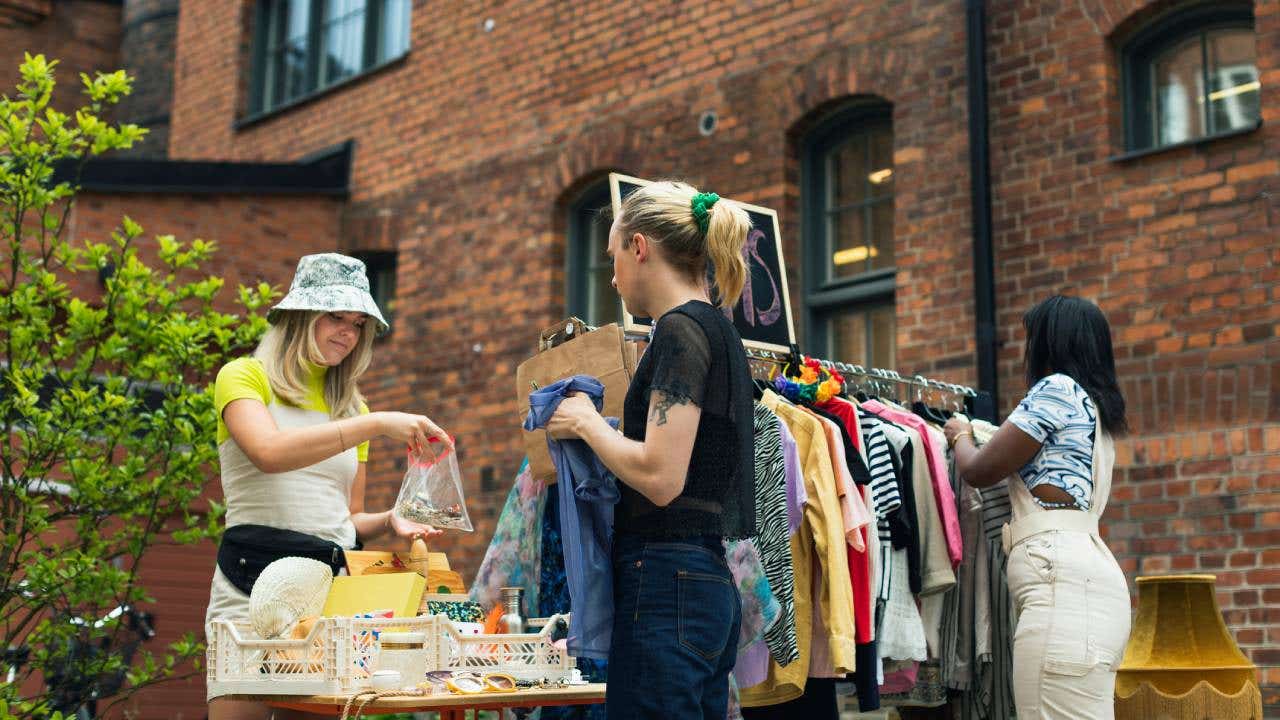 A variety of young woman at a yard sale