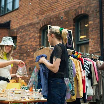 A variety of young woman at a yard sale