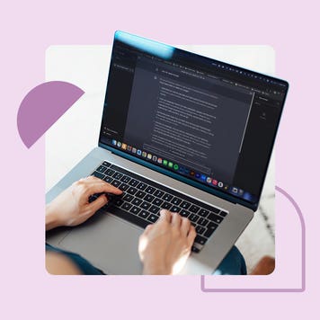 Someone typing on a laptop