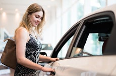 Young woman buying a new car
