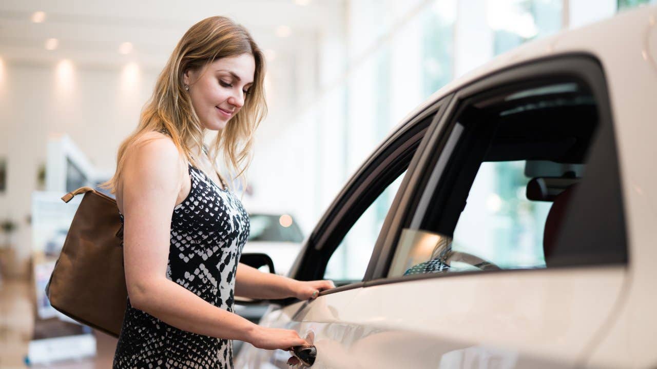 Young woman buying a new car