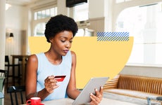 design element including women holding a credit card and on her tablet
