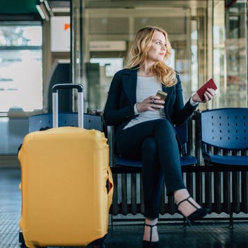 Businesswoman waiting for her flight at the airport