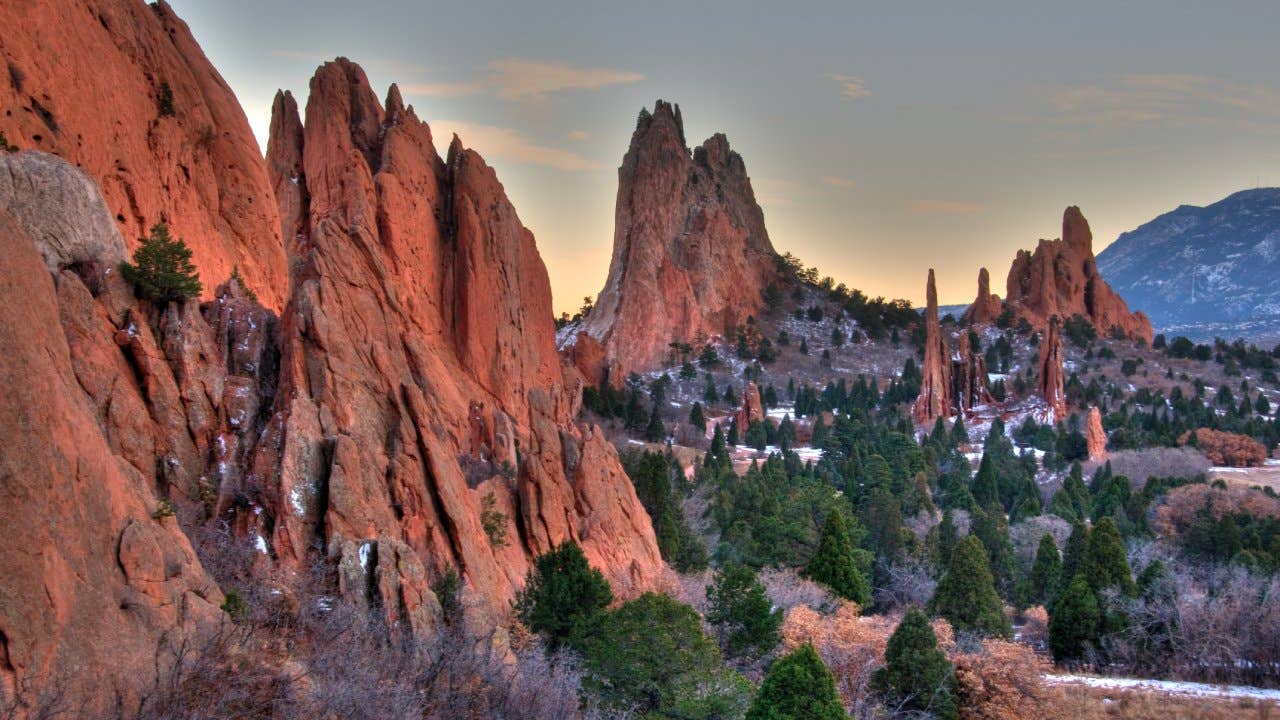 Wintry day in Colorado Springs, Colorado at Garden of Gods. Sun was setting and red rocks cast lovely glow.