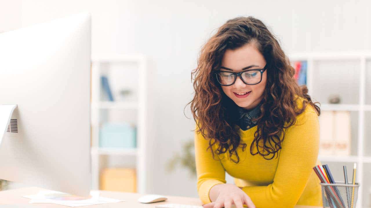 Young woman in office doing her job