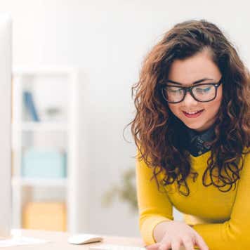 Young woman in office doing her job