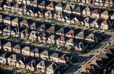 end of an era for mortgage rates - suburban homes from above