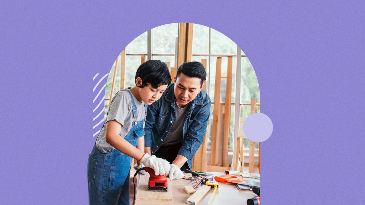 A boy and a man working together on a construction project