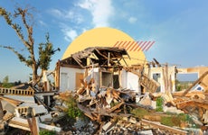 Shot of a home that has been devastated and reduced to rubble.