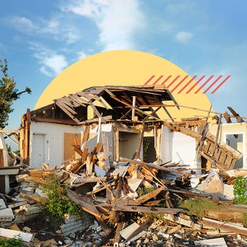 Shot of a home that has been devastated and reduced to rubble.