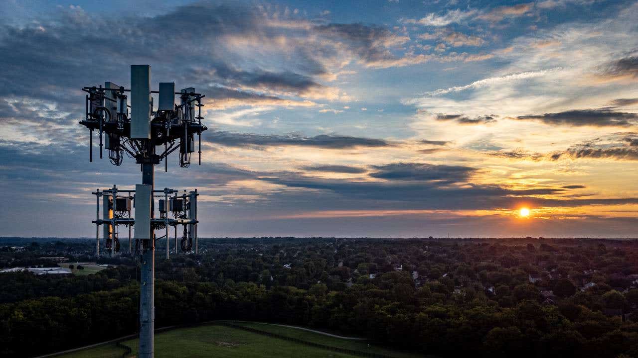 5G mobile cell phone repeater tower on the hill of a park