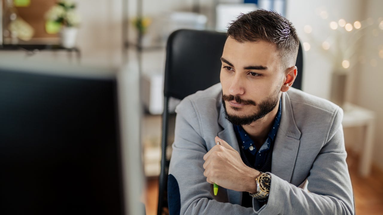 Young businessman working in his office