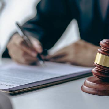 lawyer signing documents