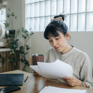 Asian women working with invoices