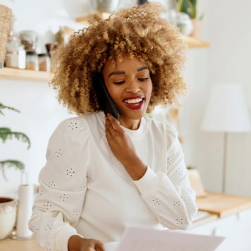Smiling woman talking with someone