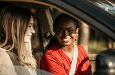 female friends driving in car