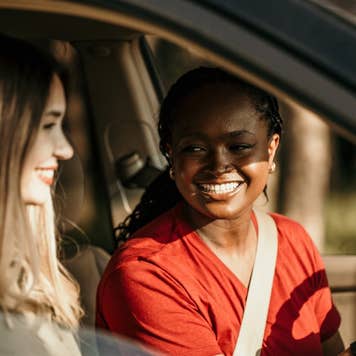female friends driving in car