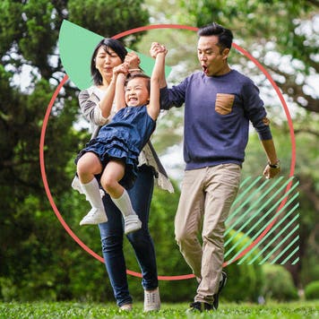 Family with child enjoying a nice time in the park on a clear day