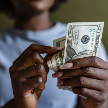 Close up of a woman counting money
