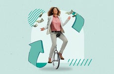 A woman riding a unicycle while balancing money