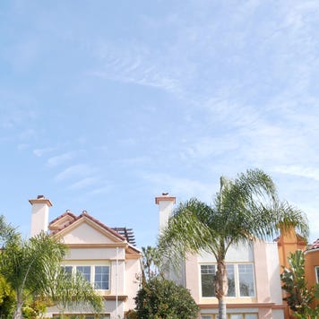 California typical suburban street, tropical Oceanside USA. Different colorful houses row