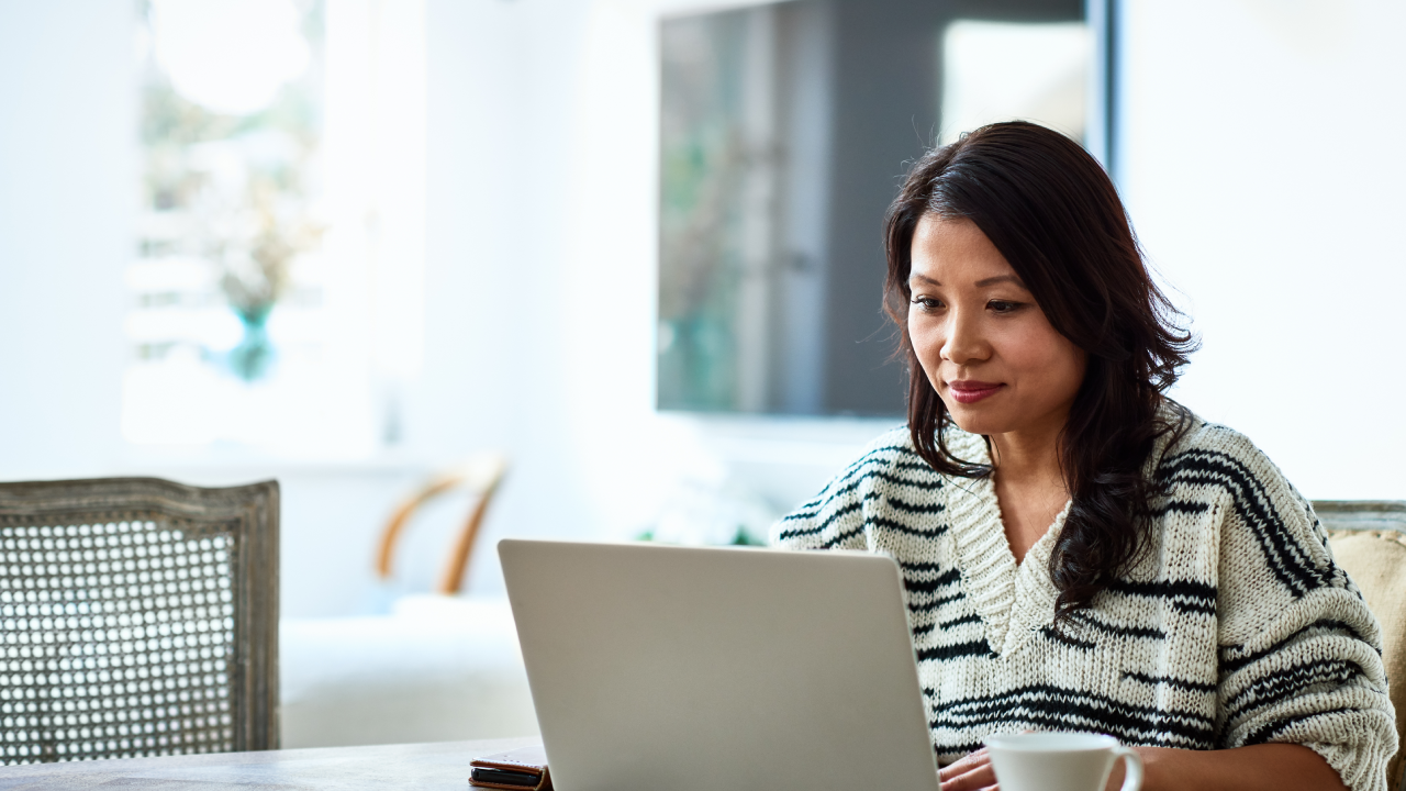 Woman using laptop and working from home